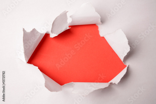 Hole ripped in paper