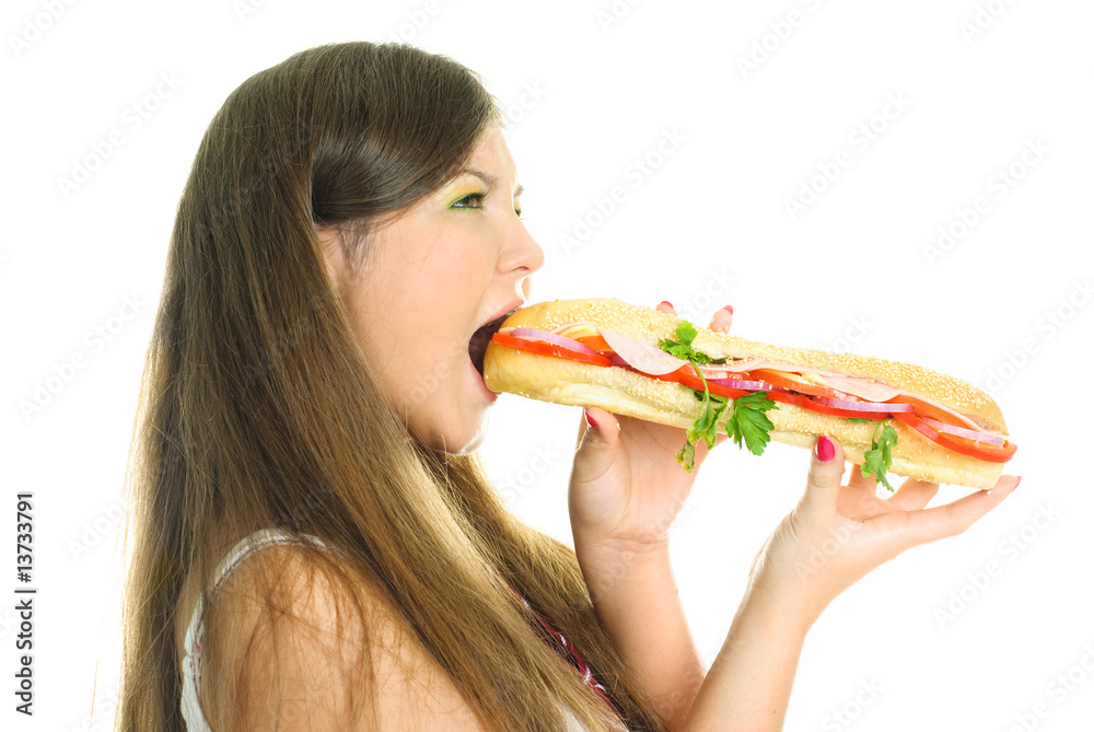 pretty girl eating a big hamburger