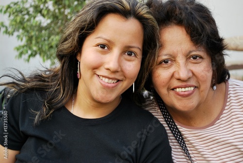 Hispanic mother and her grown daughter photo