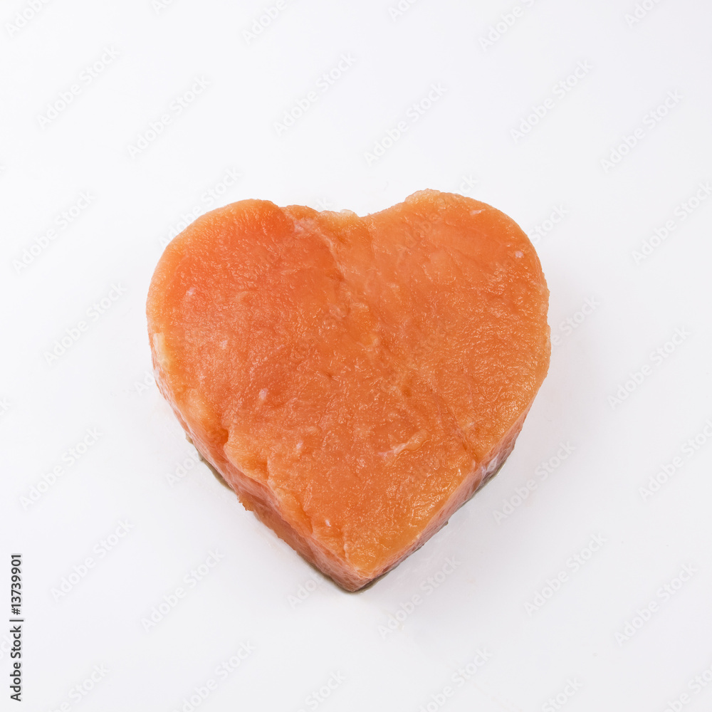 heart shaped salmon fillet on a white background