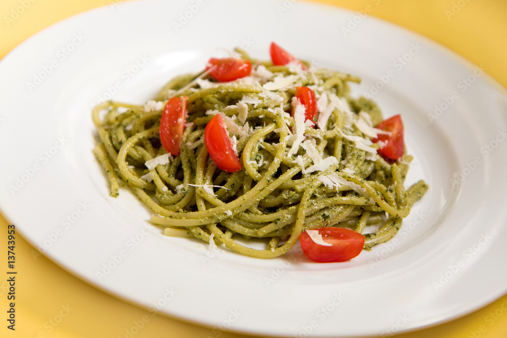Spaghetti with basil pesto and tomatoes Spaghetti with basil pesto and tomatoes