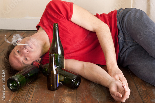 man drinking and smoking
