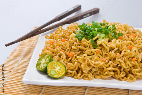 Asian noodle dish (Pancit) with Philippine lime on the side