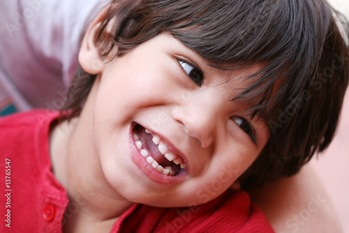 Little toddler boy smiling happily