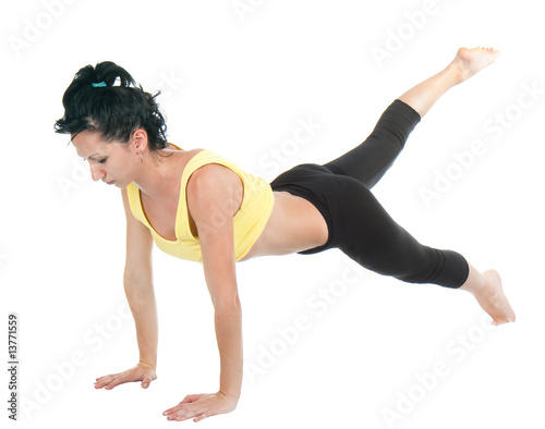 Young woman doing yoga exercise