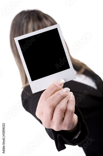 woman holding a photo in front of his face