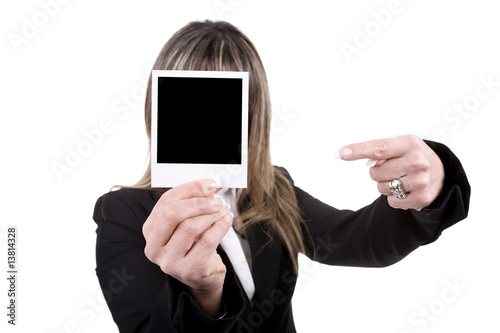 woman holding a photo in front of his face