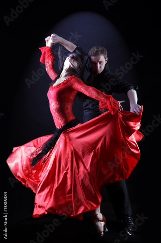 dancers in action against black background