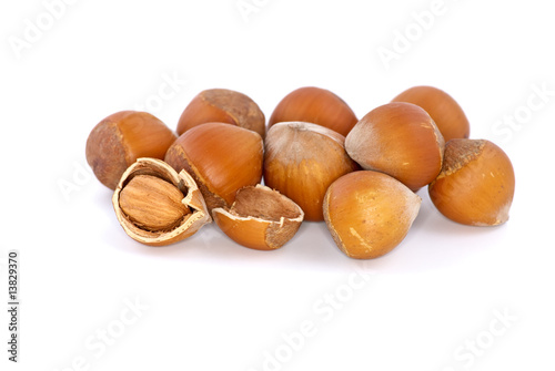 Small pile of hazelnuts and one cracked