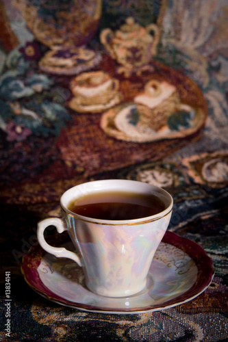 Bild auf Leinwand Cup of tea of ancient service in style of olden time