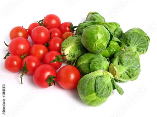 Brussels sprouts and cherry tomatoes  on white background