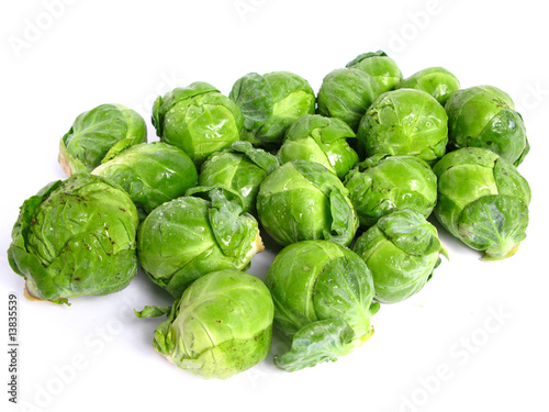 Fresh organic Brussels sprouts on white background