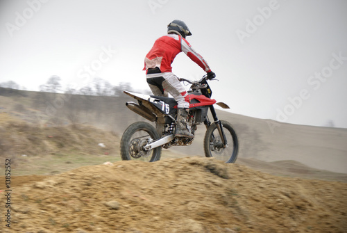 Motocross biker jumping
