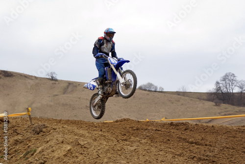 Motocross biker jumping in the air