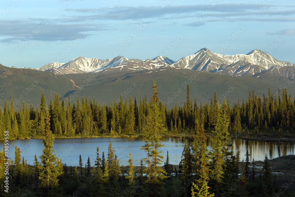 Pristine lake and mountain range in Alaska Pristine lake and mountain range in Alaska