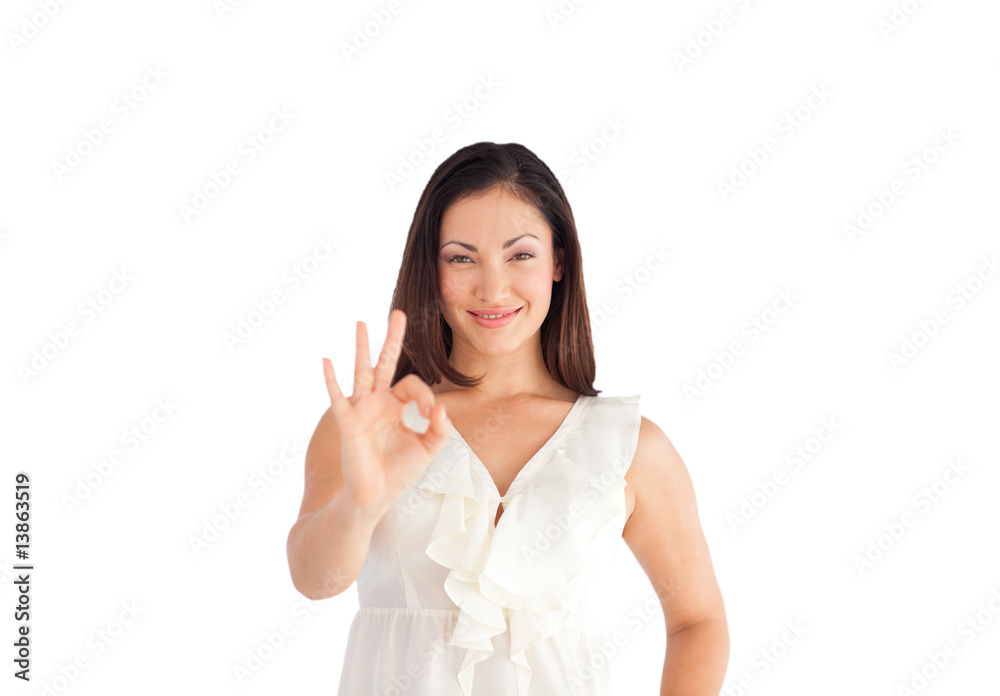 Businesswoman showing ok sing to the camera Businesswoman showing ok sing to the camera