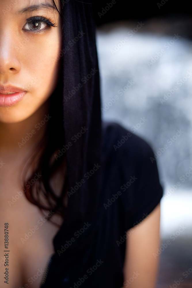 Fototapeta premium relaxing young woman at waterfall