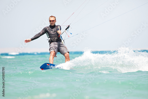 Kiteboarder surfing © Ints