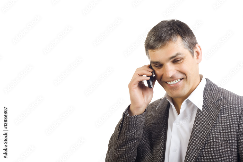 Handsome business man speaking on a mobile Handsome business man speaking on a mobile