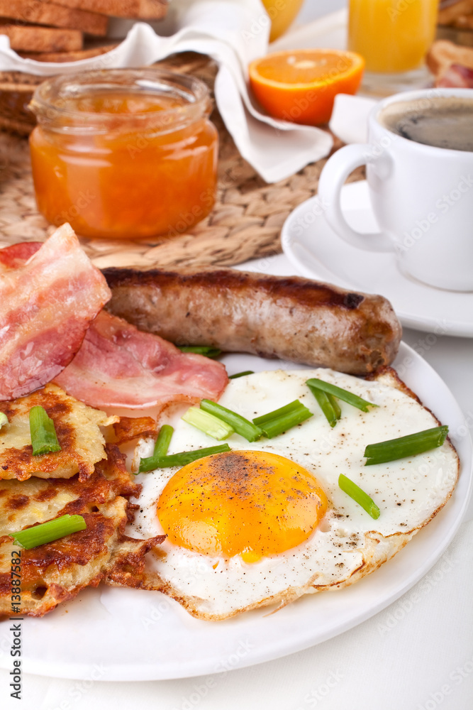 traditional American breakfast, eggs, bacon, coffee and hash bro