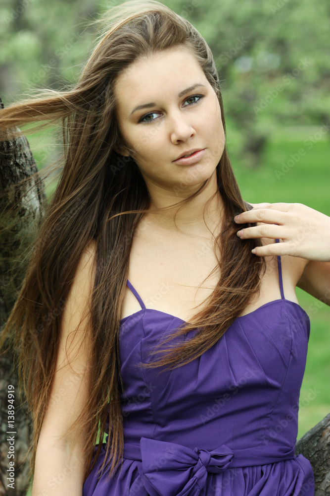 Naklejka premium Portrait young beautiful girl in the street