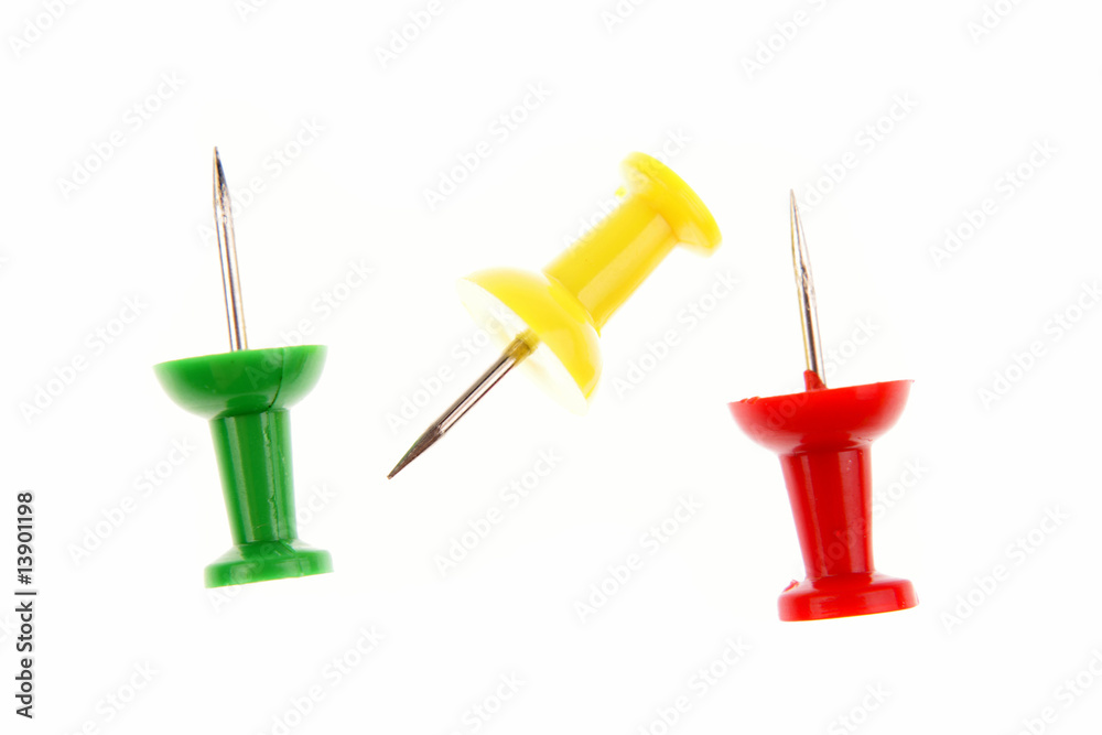 Three colorful push-pins on white background Three colorful push-pins on white background