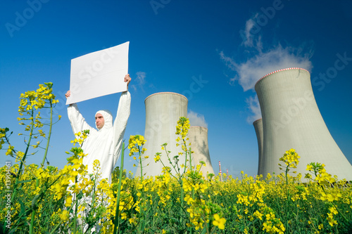Man with sign at nuclear plant