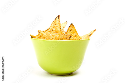 Tortilla chips in green bowl.