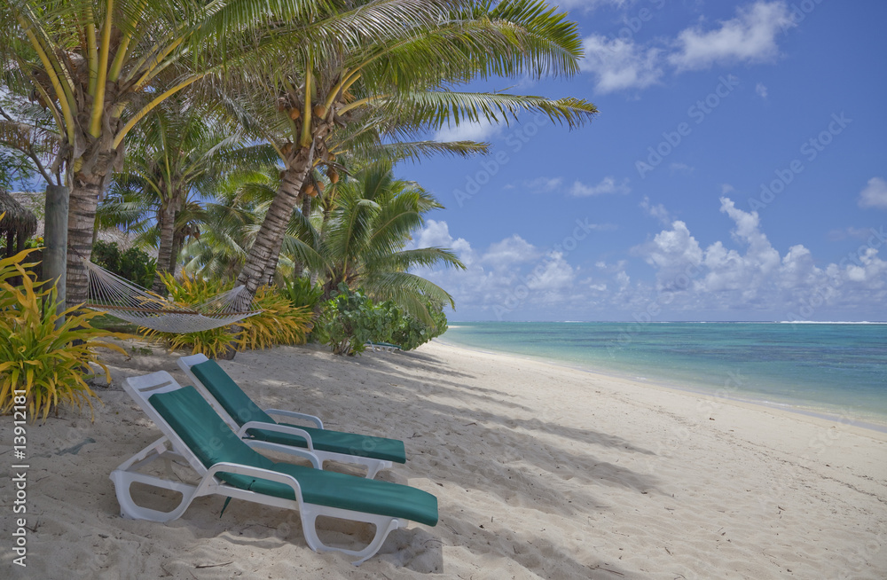 Tropical Beach with Palm Trees and Lounge Chairs
