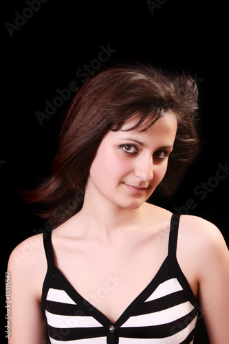Young beautiful woman portrait on black background