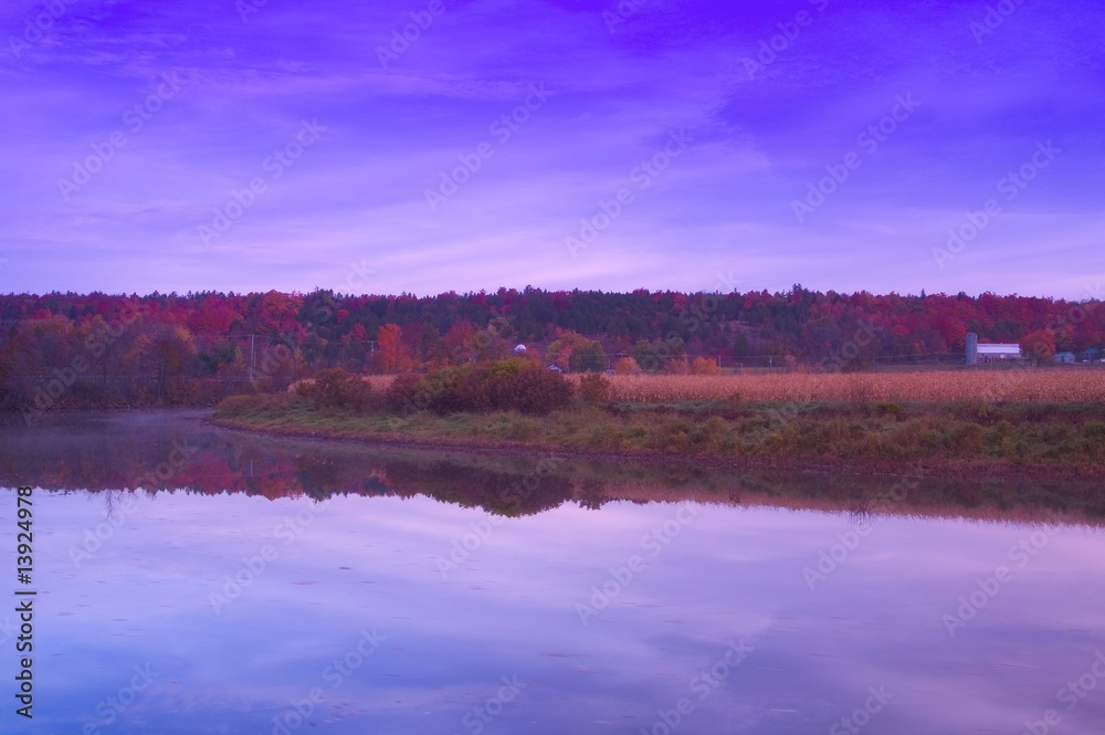 Fototapeta premium Field, water and farm building