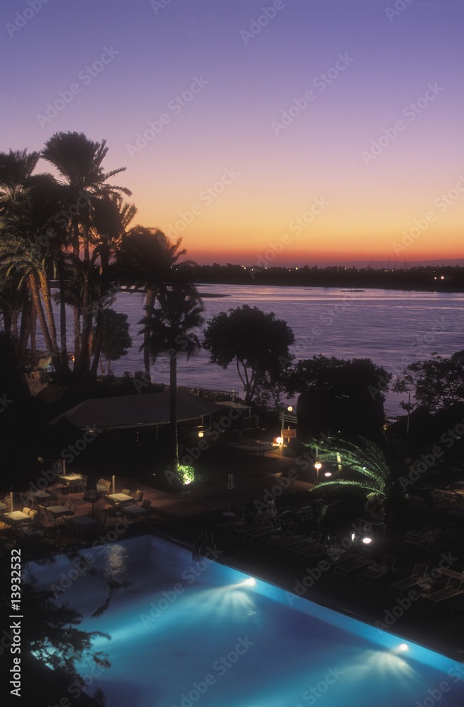 Obraz premium View over swimming pool, hotel, Nile River, Luxor, Egypt