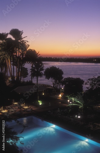 View over swimming pool, hotel, Nile River, Luxor, Egypt © Vibe Images