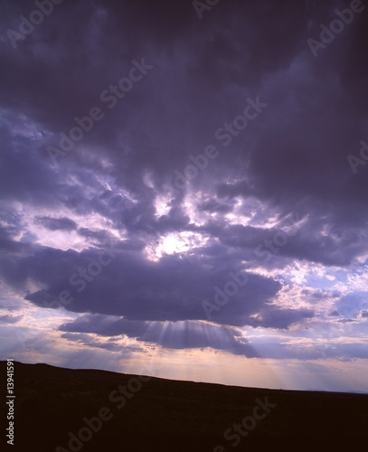 Clouds with Sun rays, "God rays," Petrified Forest National Park
