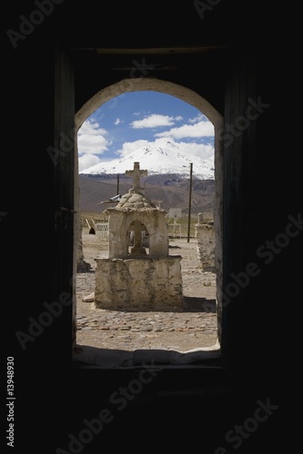 View of grave through window, Guallatire, South America photo