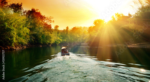 sunset in jungle and boat