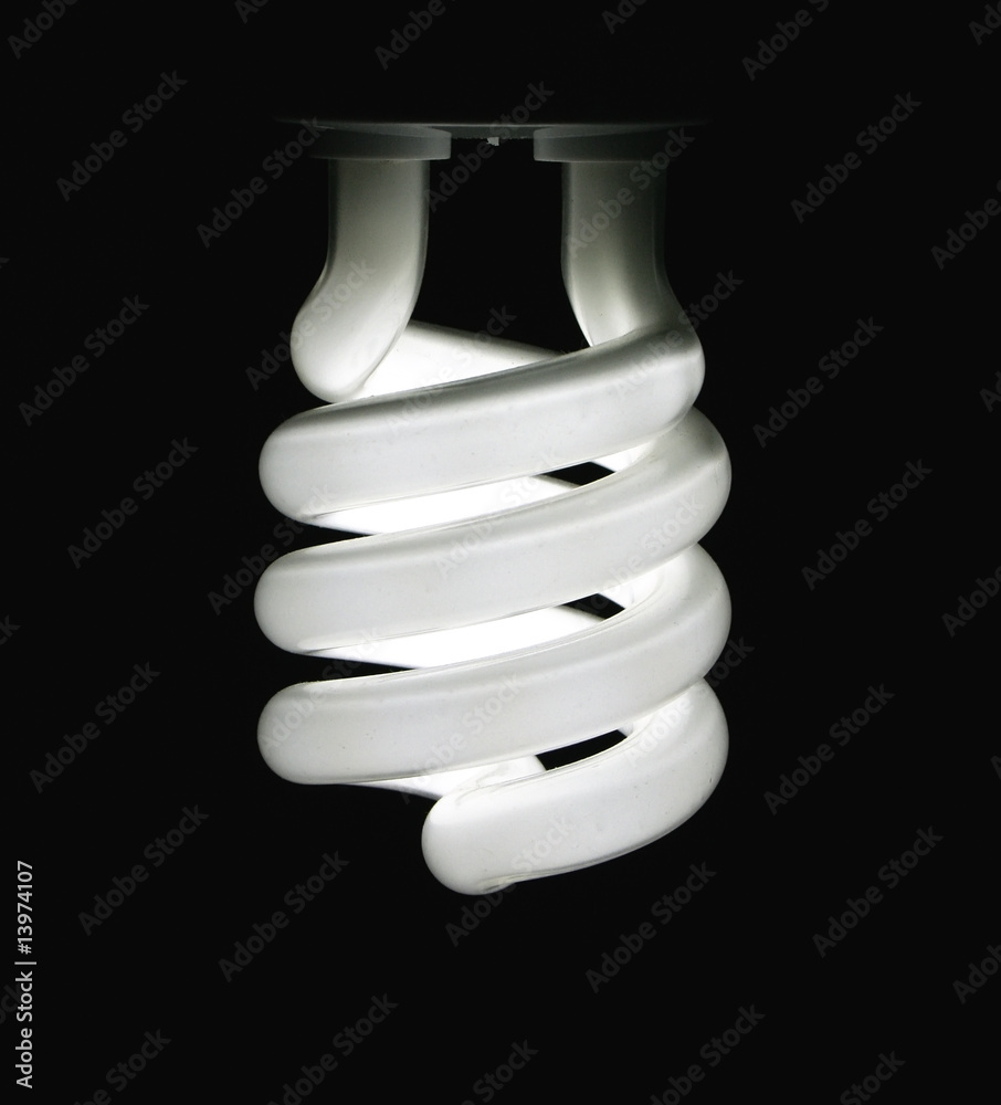 Energy saving lightbulb lighting up Energy saving lightbulb lighting up