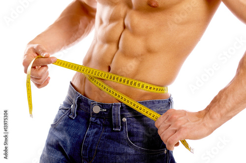 Muscular and tanned male body parts is being measured photo
