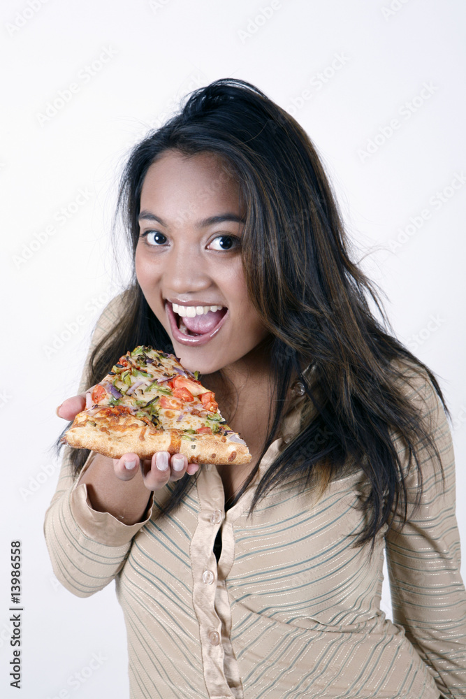 girl eating pizza slice
