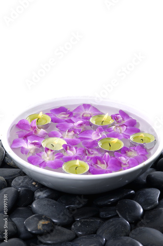 Floral scented water and black pebbles