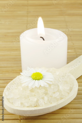 bath salt and candle on wooden background