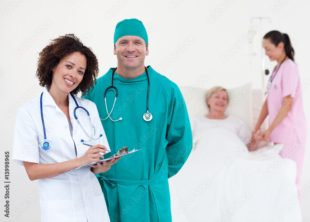 Doctors and nurse attending to a patient Doctors and nurse attending to a patient