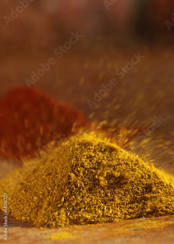 hot curry powder in a pile flying away