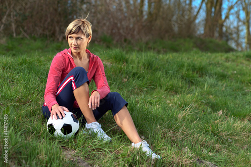 Sportswoman Sitting with a Ball