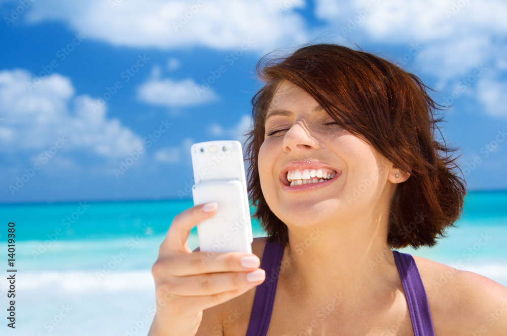happy woman with phone on the beach happy woman with phone on the beach
