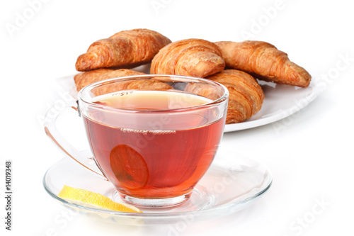 Fresh croissant and cup of tea