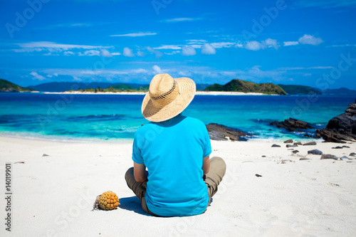 Man looking at coral island of Okinawa