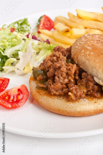 minced meat burger with french fries and salad