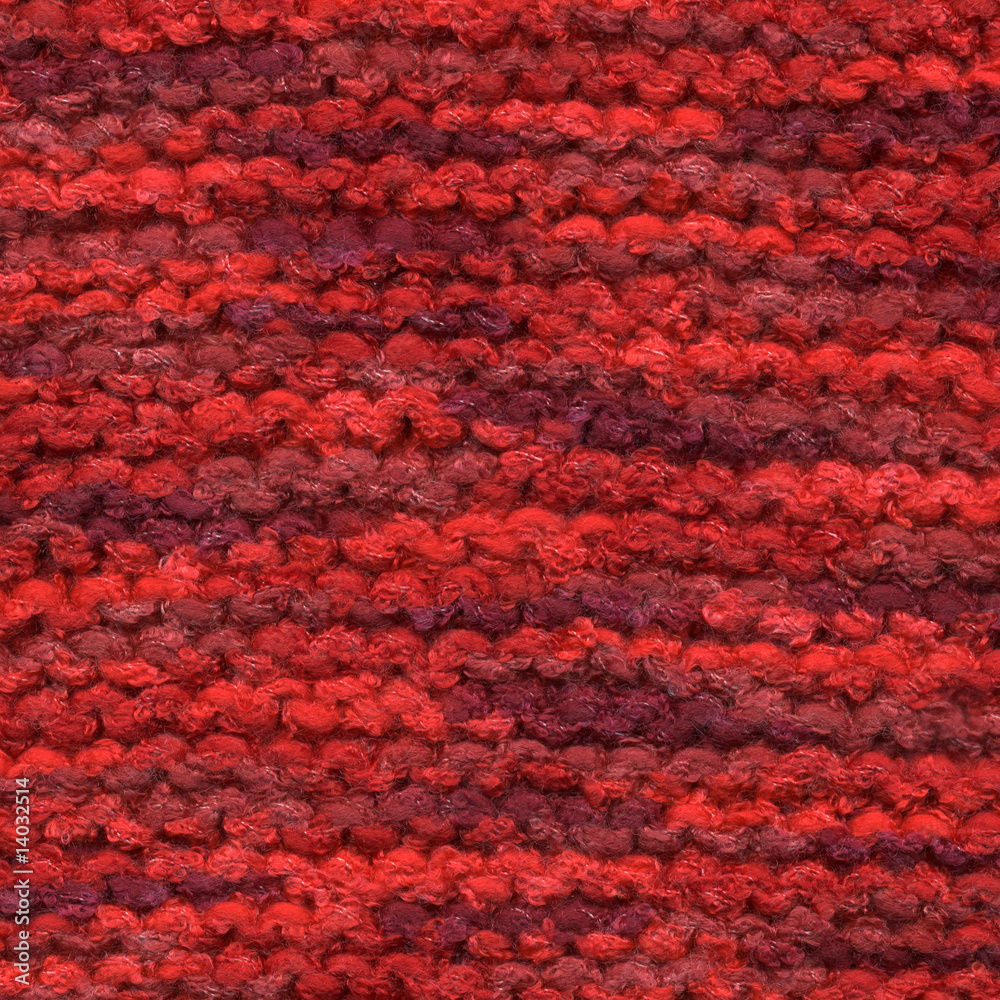 Red colors knitted wool line close up.