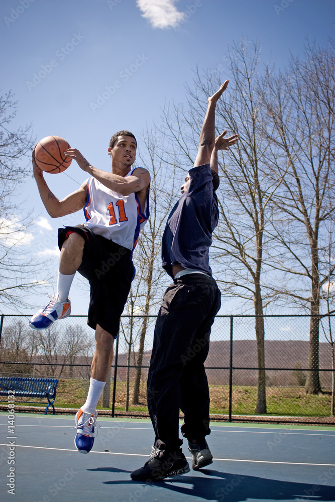 Fototapeta premium Men Playing Basketball